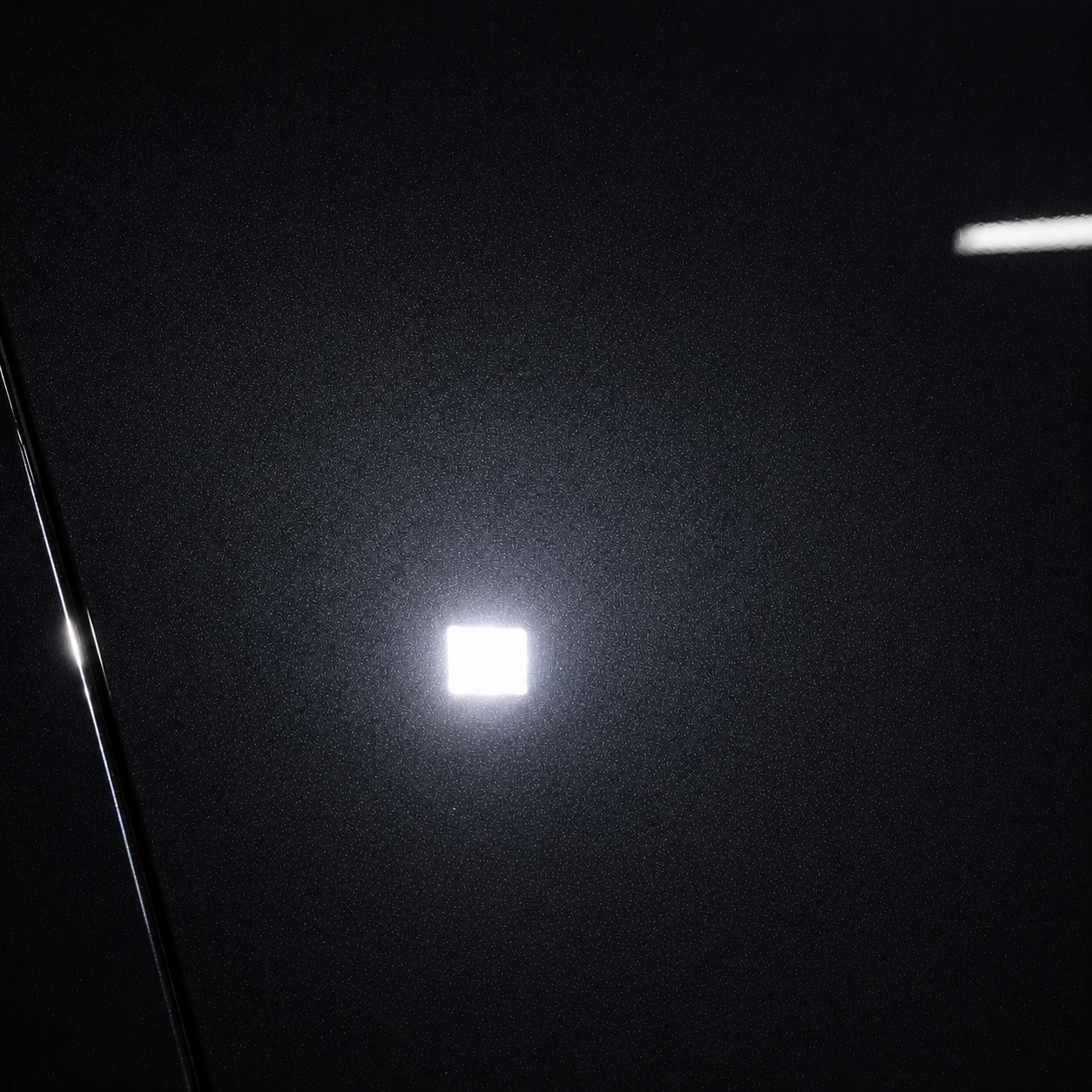 Black paint after correction, with a clearer light reflection